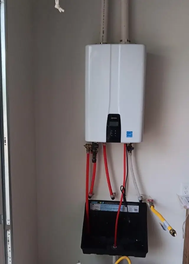 Tankless water heater with red and black supply lines
